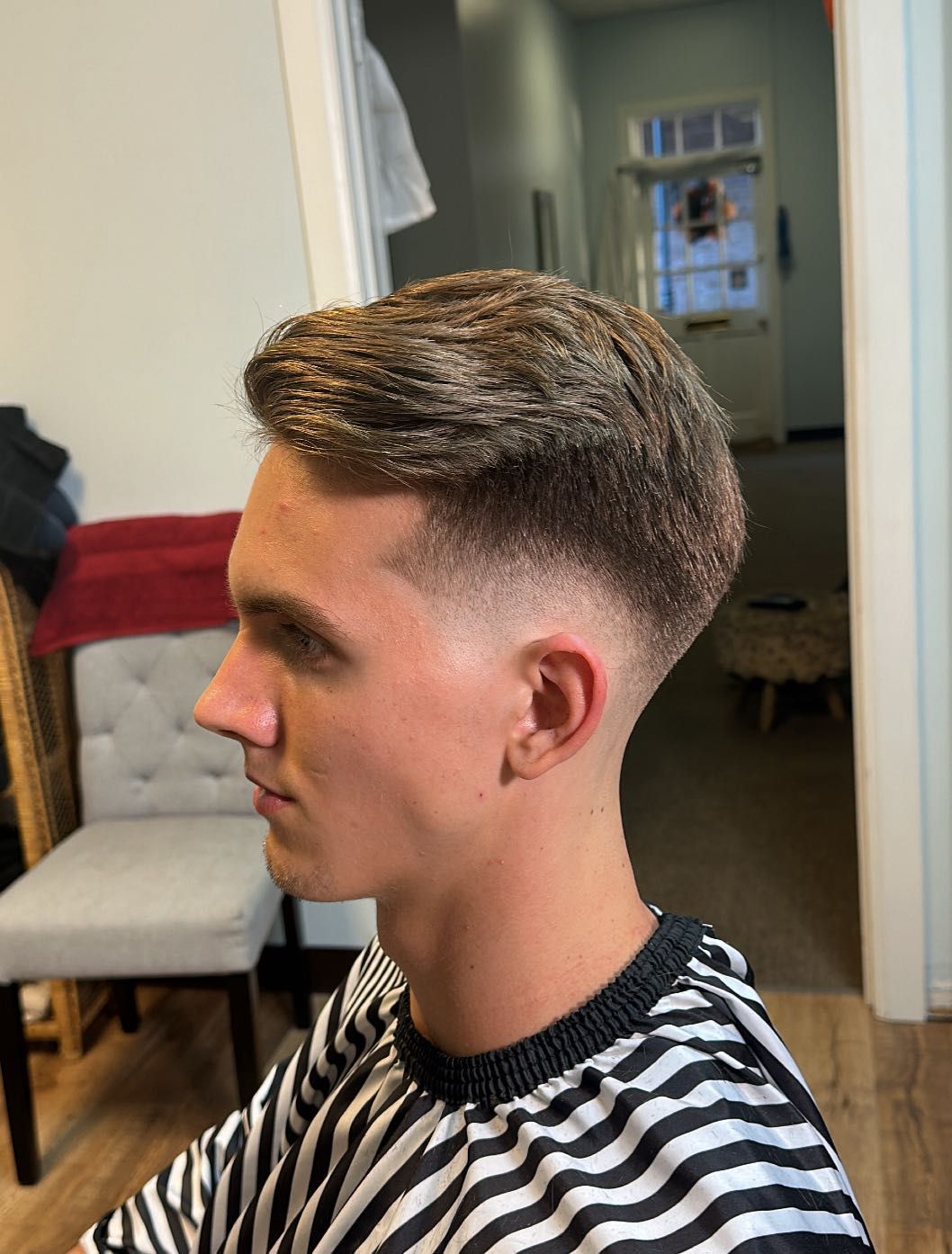 Textured quiff with mid taper fade