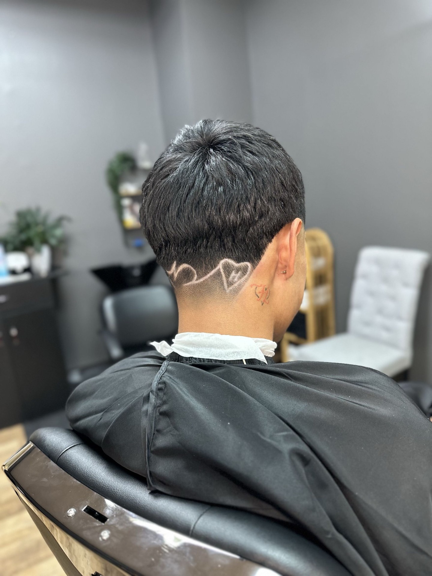 Custom hair design carved into fade
