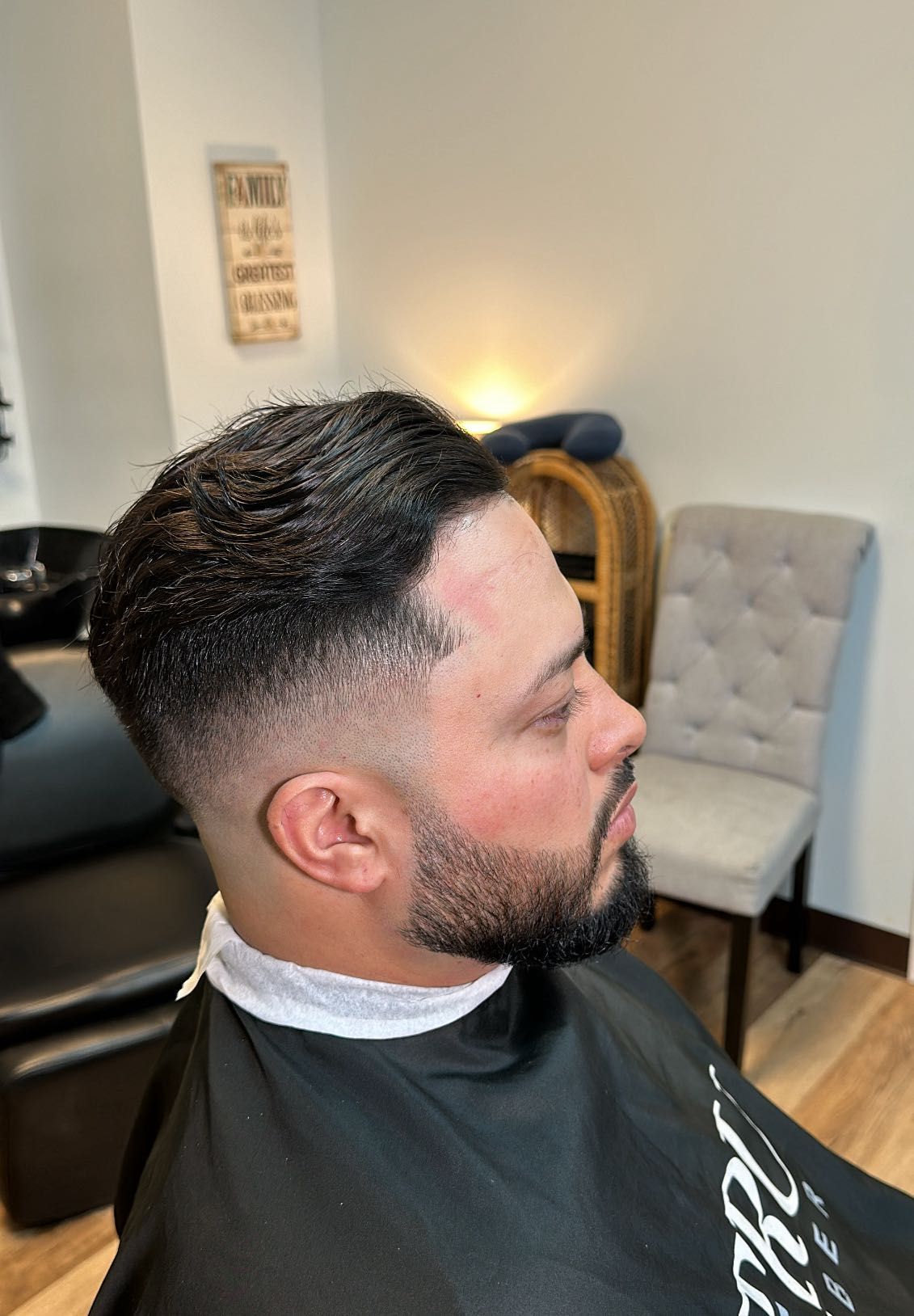 Textured pomp with mid skin fade